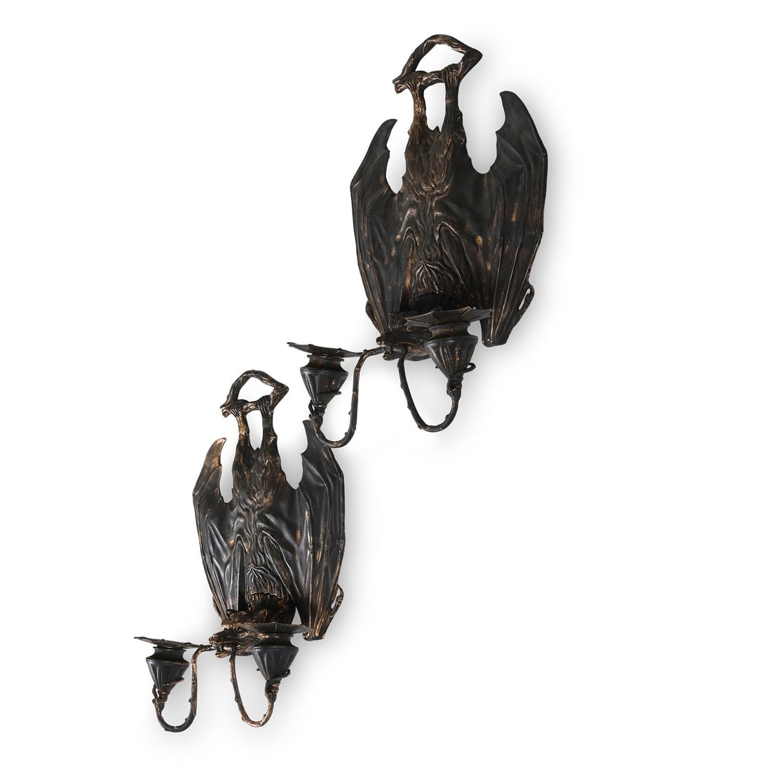 AFTER WILLIAM TONKS & SONS FOR LIBERTY'S; PAIR OF 'HANGING BAT' WALL SCONCES; 20TH CENTURY: AFTER WILLIAM TONKS & SONS FOR LIBERTY'SPAIR OF 'HANGING BAT' WALL SCONCES; 20TH CENTURYDark patinated metal, modelled as hanging bats, with branches in their mouths holding up the two sconces, with r