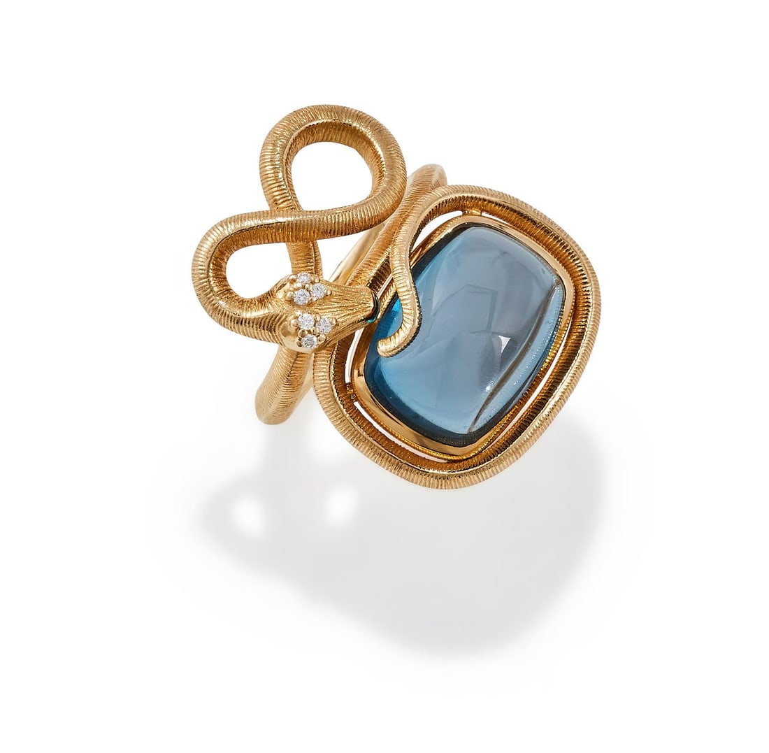 OLE LYNGGAARD, A 'SNAKES RING PETITE' DIAMOND AND BLUE TOPAZ RING: OLE LYNGGAARD, A 'SNAKES RING PETITE' DIAMOND AND BLUE TOPAZ RING LONDON 2020 The cushion shaped cabochon blue tourmaline within a knotted textured 18ct gold serpent surround, with brilliant cut diamo