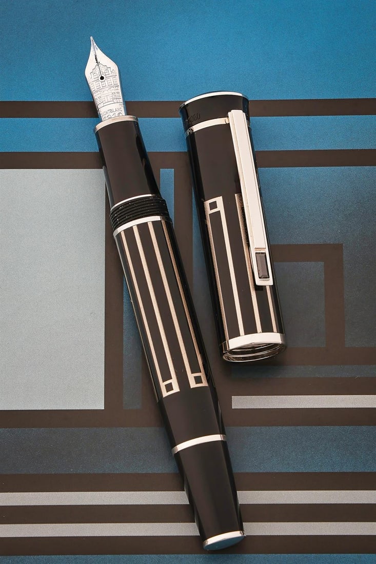 MONTBLANC, WRITERS EDITION, THOMAS MANN, A LIMITED EDITION FOUNTAIN PEN: MONTBLANC, WRITERS EDITION, THOMAS MANN A LIMITED EDITION FOUNTAIN PEN, NO. 03882/12000, 2009 Cap and Barrel: Black and silver effect geometric enamel with chromed clips, Thomas Mann facsimile signatu
