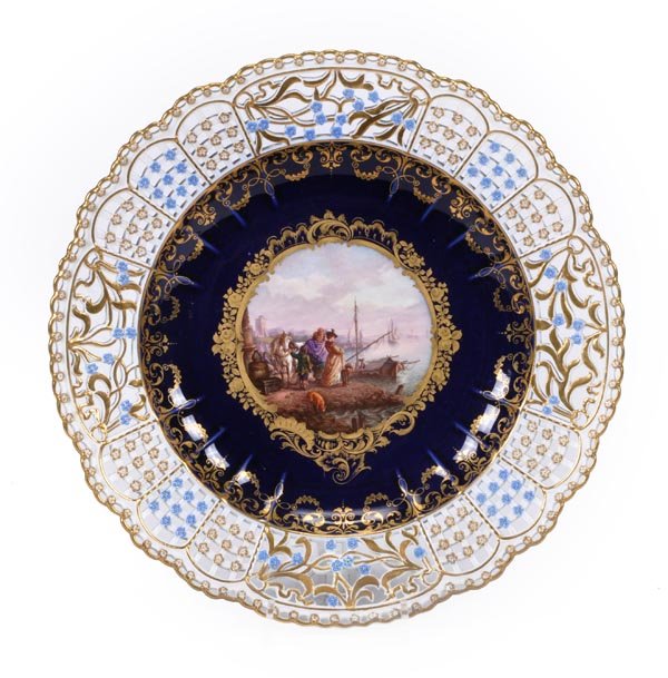 A Meissen blue-ground cabinet plate with reticulat: A Meissen blue-ground cabinet plate with reticulated rim, painted with a seventeenth century harbour scene, 25.5cm diameter, blue crossed swords mark, late 19th century