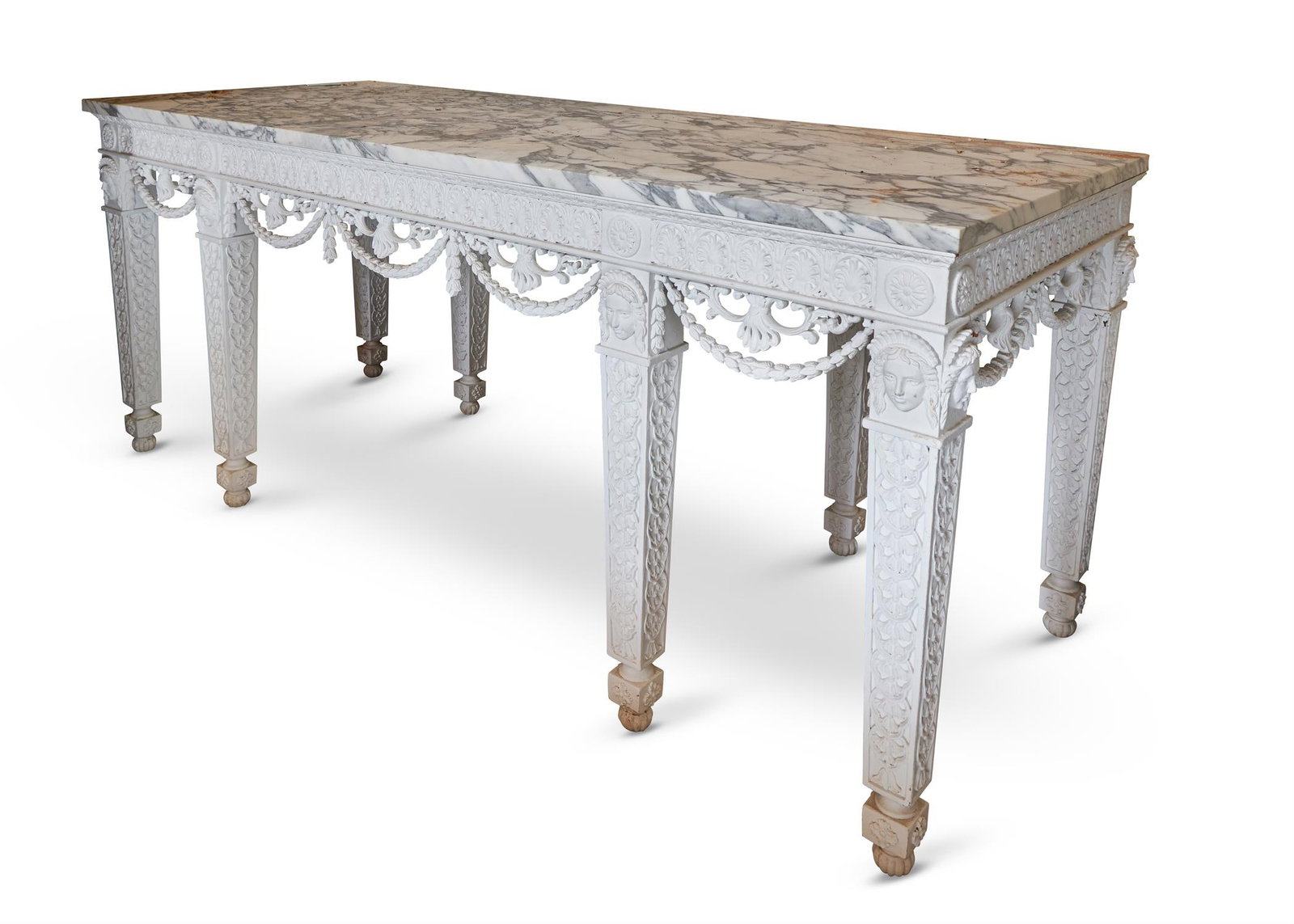 A WHITE PAINTED 'CROOME COURT' CONSOLE TABLE, MODERN: A WHITE PAINTED 'CROOME COURT' CONSOLE TABLEMODERN, BY A MODERN GRAND TOURWith a marble top above female masks and foliate carvings89cm high, 212cm wide, 85cm deep The table corresponds to a pattern d