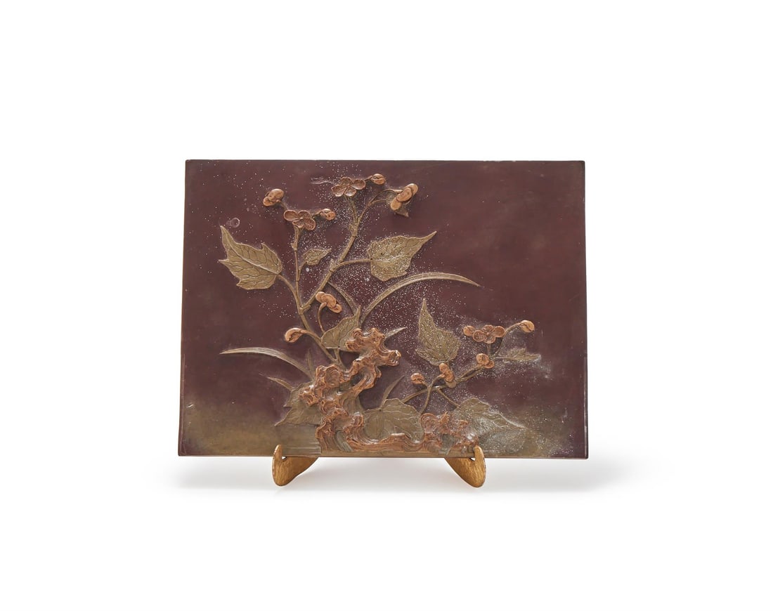 A Chinese carved qiyang soapstone panel: A Chinese carved qiyang soapstone panel, Qing Dynasty, carved in relief with begonia stems issuing from garden rockeries, 23.3cm long x 17.4cm wide清 祁陽石雕秋