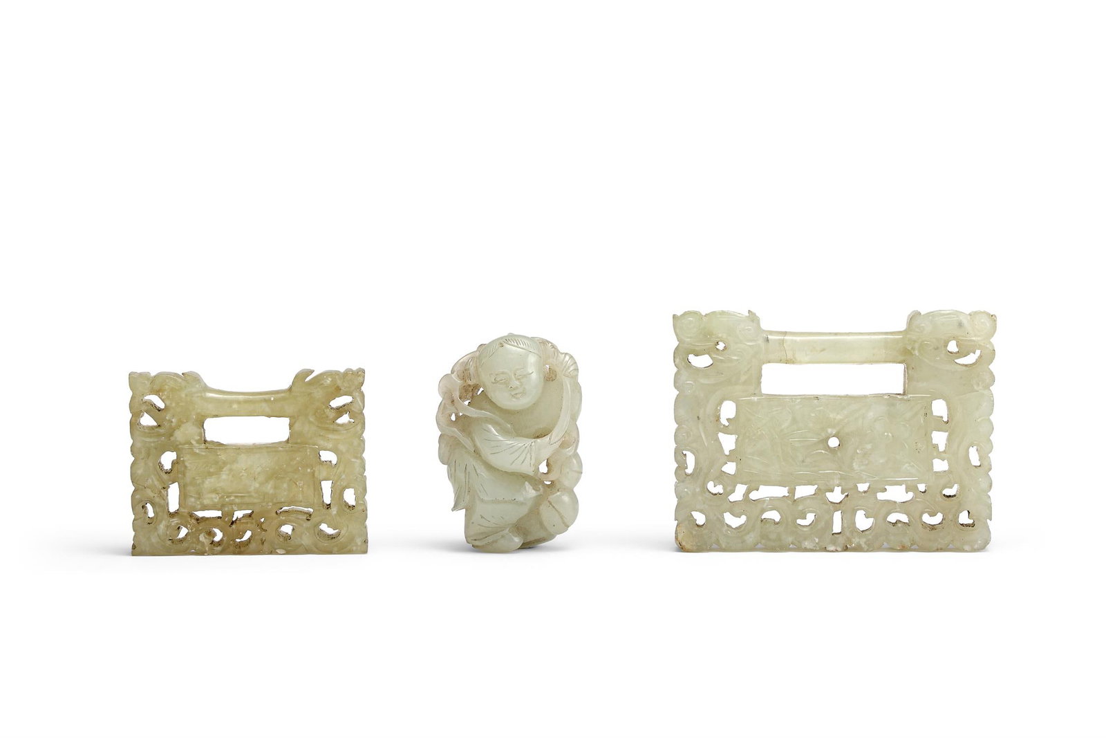 A Chinese celadon jade figure of a boy (1 of 3)