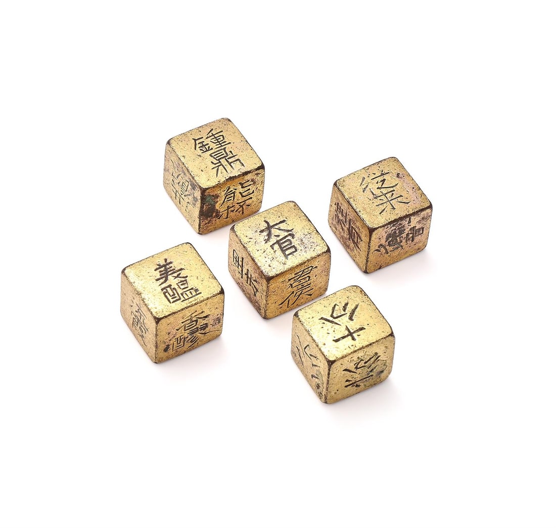 A rare group of five Chinese gilt bronze 'Drinking games' dice (1 of 2)