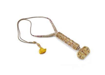 A gem-set jade knife handle and pendant combined as a necklace: A gem-set jade knife handle and pendant combined as a necklace, North India, 19th century, set with precious stones and raised gold, the knife handle 7.7cm high x 2cm diameter and the pendant 4.5cm wi