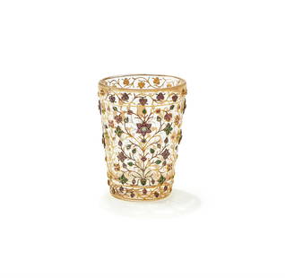 A rare Mughal gem-set rock crystal cup: A rare Mughal gem-set rock crystal cup, India, 19th century, the rock crystal carved in the form of a cup, set with gold floral tendrils highlighted with rubies, emerald, sapphires and diamonds, 11.2c