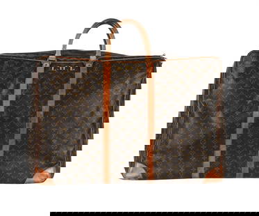 LOUIS VUITTON, A MONOGRAMMED COATED CANVAS SUITCASE: LOUIS VUITTON  A MONOGRAMMED COATED