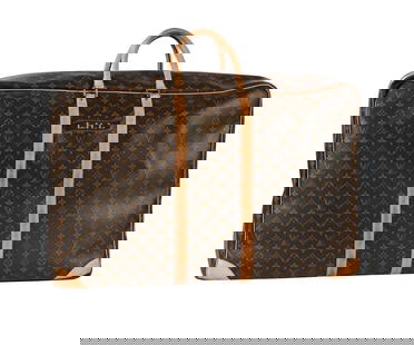 LOUIS VUITTON, A MONOGRAMMED COATED CANVAS SUITCASE: LOUIS VUITTON A MONOGRAMMED COATED C