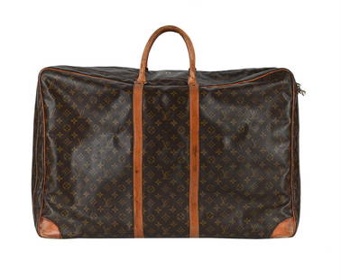LOUIS VUITTON, A MONOGRAMMED COATED CANVAS SUITCASE: LOUIS VUITTON A MONOGRAMMED COATED C