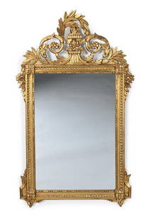 A CARVED GILTWOOD MIRROR, IN LOUIS XVI STYLE, 20TH CENTURY: A CARVED GILTWOOD MIRROR