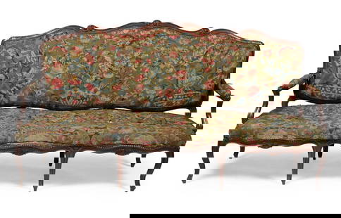 A CARVED WALNUT AND NEEDLEWORK UPHOLSTERED SOFA OR CANAPE, IN LOUIS XV STYLE, FRENCH, 19TH CENTURY: A CARVED WALNUT AND GROS-POINT NEEDLEWORK UPHOLSTERED SOFA OR CANAPE