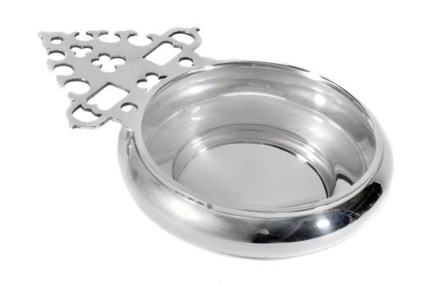 An Italian silver coloured porringer by Bulgari, s: An Italian silver coloured porringer by Bulgari, stamped 'Bvlgari 925' with an Italian control marks and date '1976', late 20th century, with a flat scroll pierced handle, the circular bowl bellied, 2