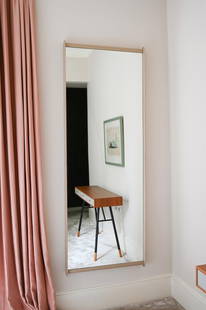 ROBERTO LAZZERONI (B.1950), FOR POLTRONA FRAU, A 'DORIAN' MIRROR, MODERN: ROBERTO LAZZERONI (B.1950) FOR POLTRONA FRAUA 'DORIAN' MIRROR, MODERNSolid beech frame clad in grey leather186cm high, 69cm deep, 7.5cm protuberance Provenance:Purchased from Poltrona Frau UK Ltd.Born