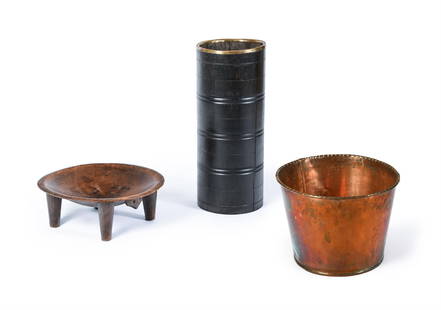 A HARDWOOD CYLINDRICAL STICK STAND, 20TH CENTURY, TOGETHER WITH A STOOL AND A BUCKET: A HARDWOOD CYLINDRICAL STICK STAND20TH CENTURYWith brass rim66cm high, 27cm diameterTOGETHER WITH A Kava bowl, 17cm high, 48cm wide and a copper planter, 33cm high, 45.5cm diameter (3)