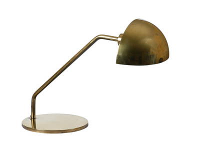 A BRASS DESK LAMP, SECOND HALF 20TH CENTURY: A BRASS DESK LAMPSECOND HALF 20TH CENTURYWith demi-lune shade40.5cm high, 56.5cm long, 24cm diameter at base