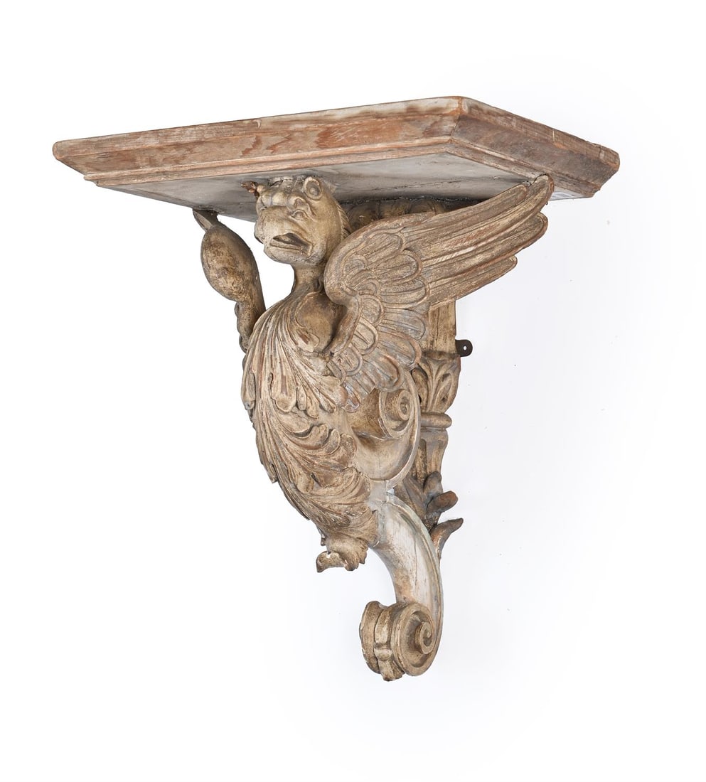 A LARGE GEORGE II CARVED WALL BRACKET WITH GRYPHON SUPPORT, CIRCA 1810 - 1830: A LARGE GEORGE II CARVED WALL BRACKET WITH GRYPHON SUPPORT CIRCA 1810 - 1830 Possibly for a clock or bust 48cm high, 41cm wide, 31cm deep Provenance: Rushbrooke Hall, Suffolk installed as part of the
