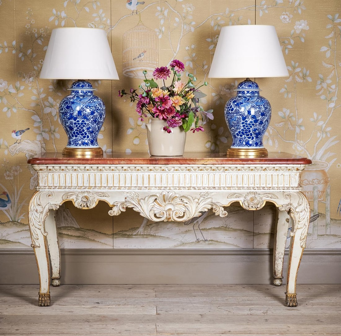 A CREAM PAINTED AND PARCEL GILT CONSOLE TABLE, PROBABLY IRISH, 19TH CENTURY: A CREAM PAINTED AND PARCEL GILT CONSOLE TABLEPROBABLY IRISH, 19TH CENTURYWith a variegated red marble top80cm high, 152cm wide, 66.5cm deepPlease note, the table is probably 19th century in date, and