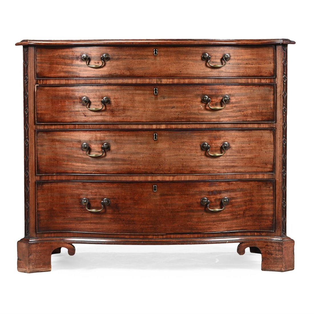 A GEORGE III MAHOGANY AND CROSSBANDED SERPENTINE DRESSING COMMODE, CIRCA 1760: A GEORGE III MAHOGANY AND CROSSBANDED SERPENTINE DRESSING COMMODEIN THE MANNER OF THOMAS CHIPPENDALE, CIRCA 1760The upper drawer fitted with an arrangement of lidded storage around a central ratchet a