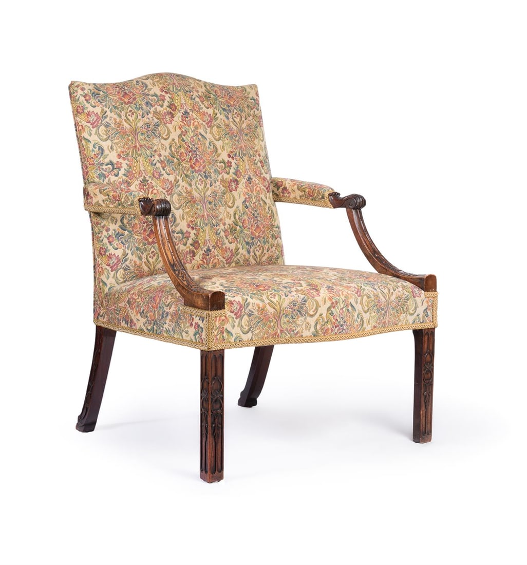 A GEORGE III 'RED WALNUT' ARMCHAIR, CIRCA 1760: A GEORGE III 'RED WALNUT' ARMCHAIRIN THE MANNER OF THOMAS CHIPPENDALE, CIRCA 1760Of 'Gainsborough' type, incorporating blind fretwork 97cm high, 74cm wide, 71cm deepProvenance:The Lynch House, Kenswor