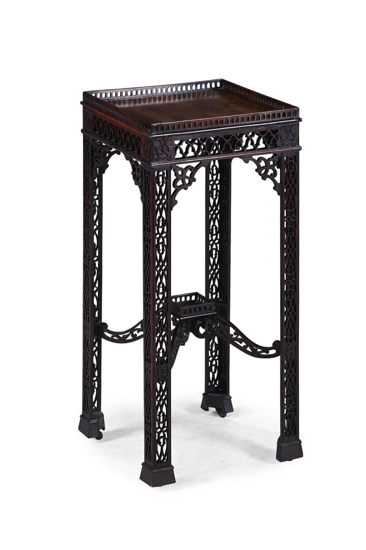 A CARVED AND PIERCED MAHOGANY URN STAND IN THE MANNER OF THOMAS CHIPPENDALE: A CARVED AND PIERCED MAHOGANY URN STANDIN THE MANNER OF THOMAS CHIPPENDALE, CIRCA 1770 AND LATERWith slide to the frieze and old sticker to underside for 'THE HAGUE COLLECTION'68cm high, 30cm wide, 30