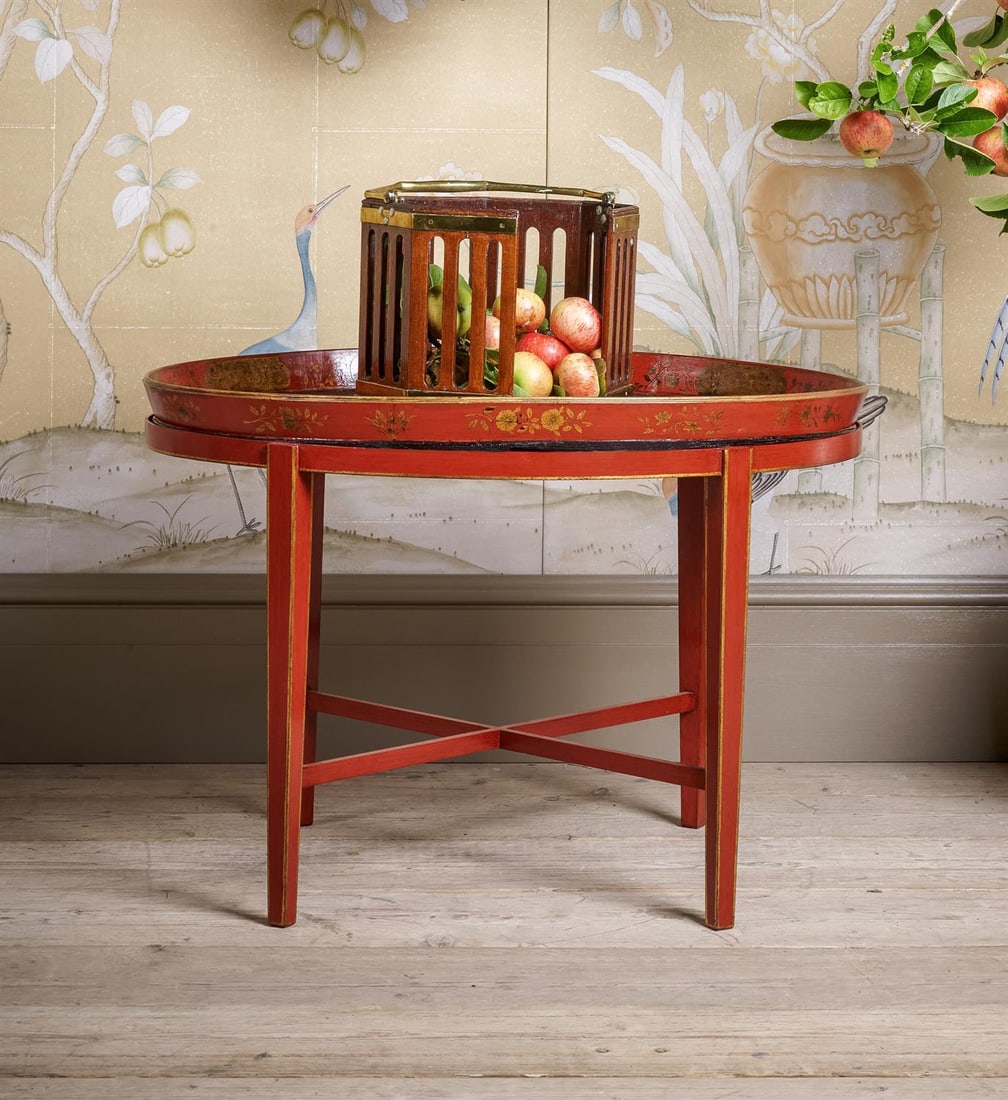 A REGENCY RED AND GILT JAPANNED CHINOISERIE TRAY: A REGENCY RED AND GILT JAPANNED CHINOISERIE TRAY, ON A STAND AS A LOW TABLECIRCA 1815 AND LATERThe tray 73 x 55cm, 5cm deep; as a table 51cm high, 73cm wide, 55cm deep