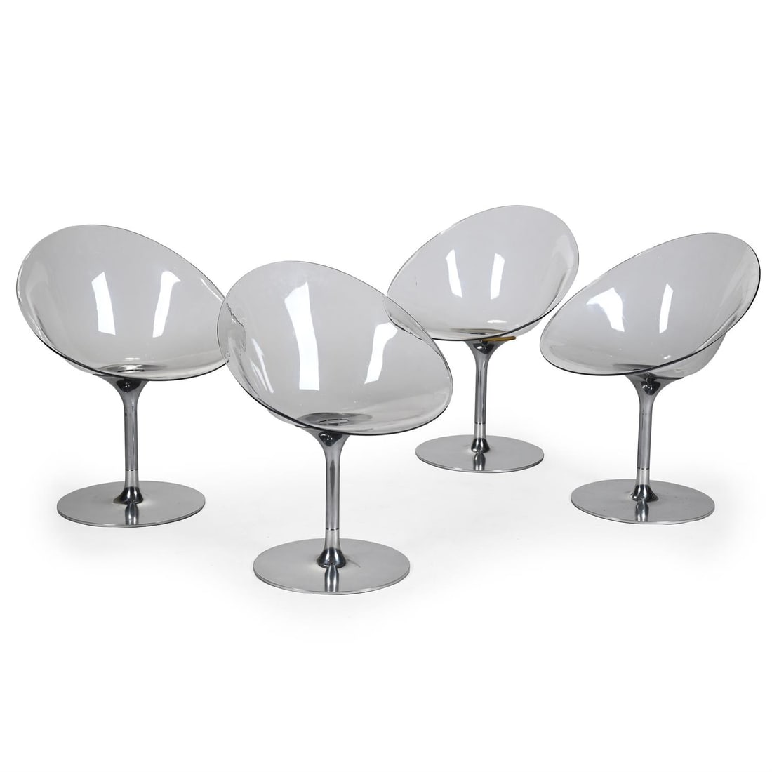 PHILIPPE STARCK (FRENCH, B.1949), FOUR CRYSTAL 'EROS' SWIVEL CHAIRS; MADE BY KARTELL: PHILIPPE STARCK (FRENCH, B.1949)FOUR CRYSTAL 'EROS' SWIVEL CHAIRS; MADE BY KARTELL; EARLY 21ST CENTURYClear lucite plastic, polished aluminium Etched maker's mark 'ERO|S|/by Kartell/with STARCK/MADE I