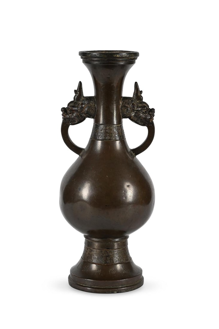 A Chinese large Inscribed bronze dragon-handled vase