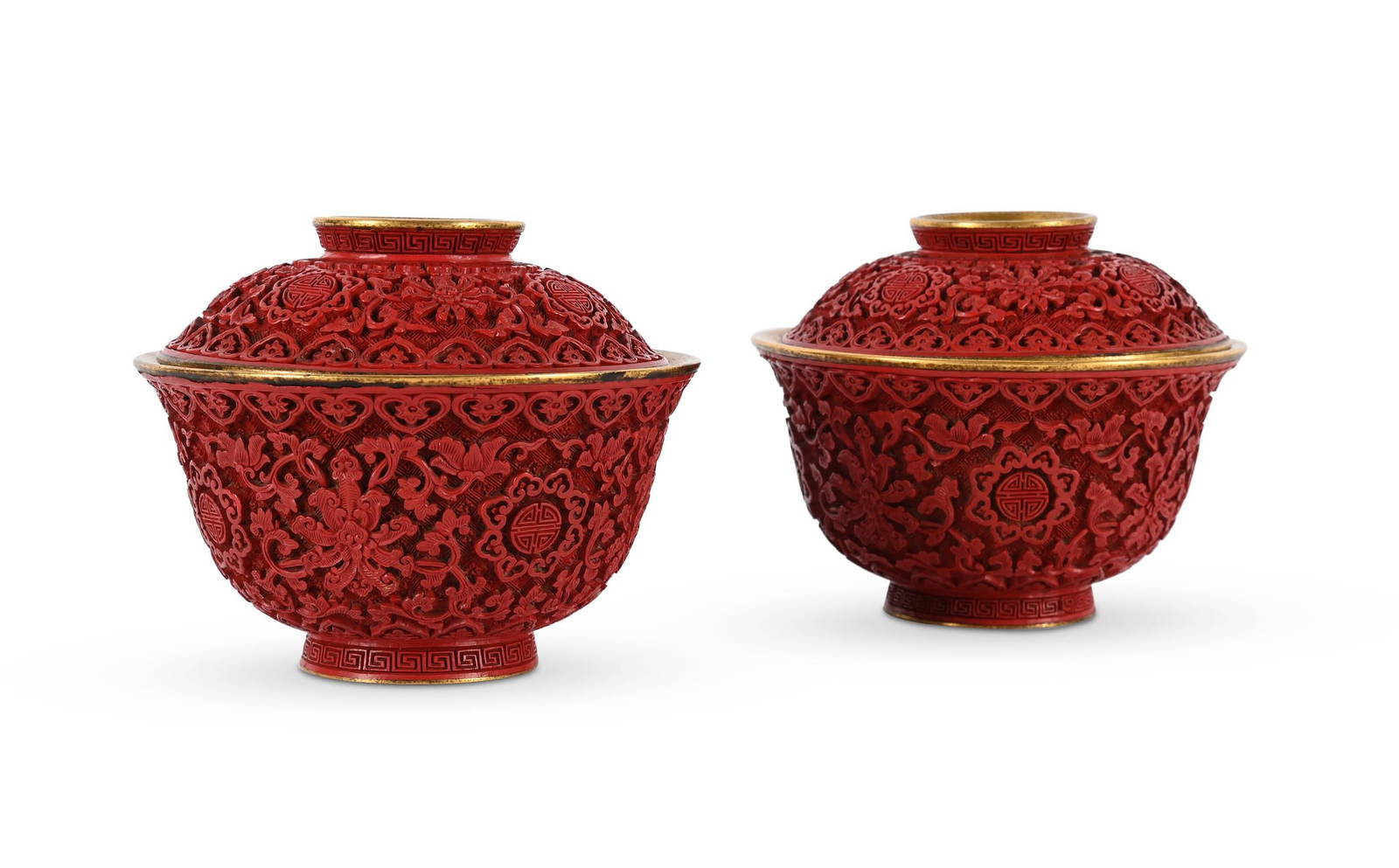 A pair of Chinese gilt bronze and cinnabar lacquer bowls and covers