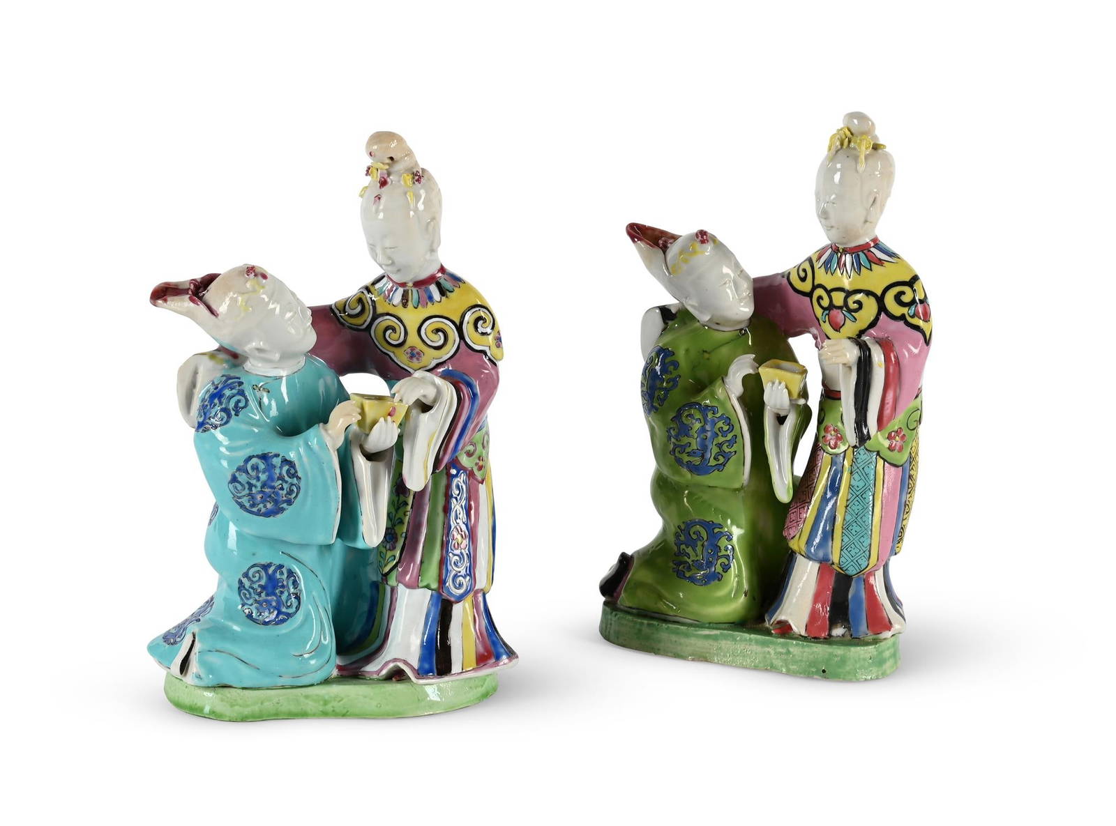 A rare pair of Chinese export porcelain Famille Rose groups of lovers