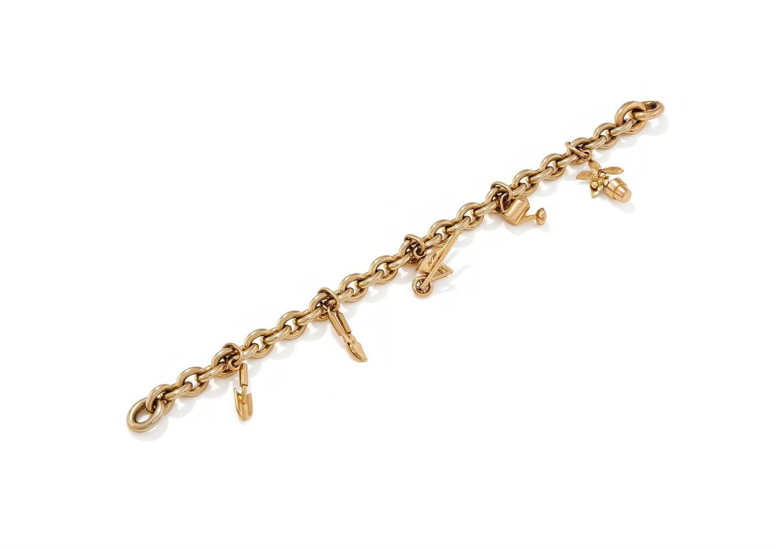 POMELLATO, A CHARM BRACELET: POMELLATO, A CHARM BRACELET The cable link bracelet suspending five gardening charms, including a spade, secateurs, a wheelbarrow, a watering can and a flowerpot, signed Pomellato, wheelbarrow numbere