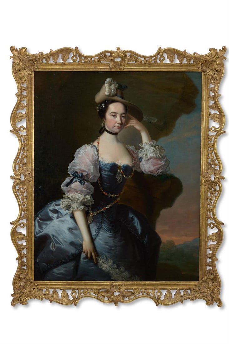 ‡ THOMAS HUDSON (1701-1779), PORTRAIT OF A LADY: ‡ THOMAS HUDSON (1701-1779)PORTRAIT OF A LADY, THREE-QUARTER-LENGTH, IN A BLUE SATIN DRESS WITH LACE SLEEVES, A LANDSCAPE BEYONDOil on canvas127 x 102cm (50 x 40 in.)Provenance: Acquired from Mackin
