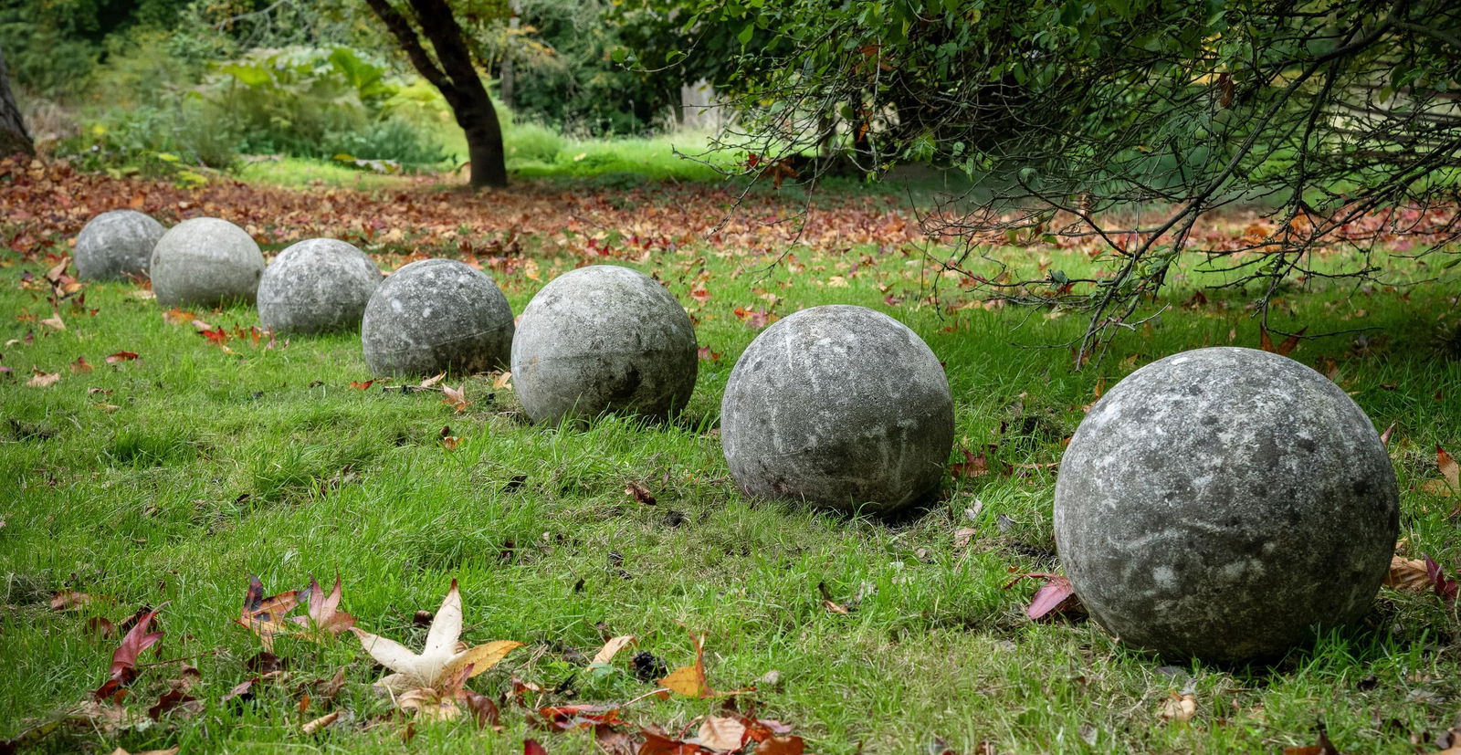 A SET OF EIGHT COMPOSITION STONE PATH OR MARKER BALLS, CONTEMPORARY (1 of 1)