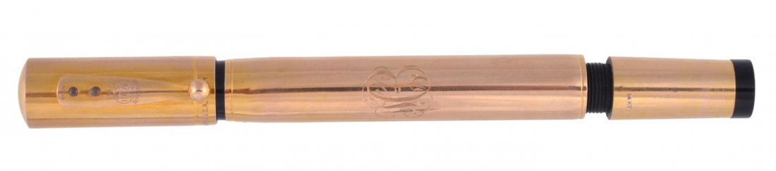 Waterman's, a gold coloured safety fountain pen, c: Waterman's, a gold coloured safety fountain pen, circa 1920, the cap and barrel stamped '14k', with retractable Waterman's Ideal size 4 nib,