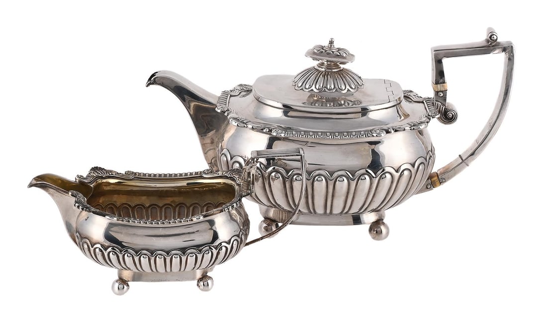 Y A GEORGE III LOBED OBLONG TEA POT AND CREAM JUG: Y A GEORGE III LOBED OBLONG TEA POT AND CREAM JUG
