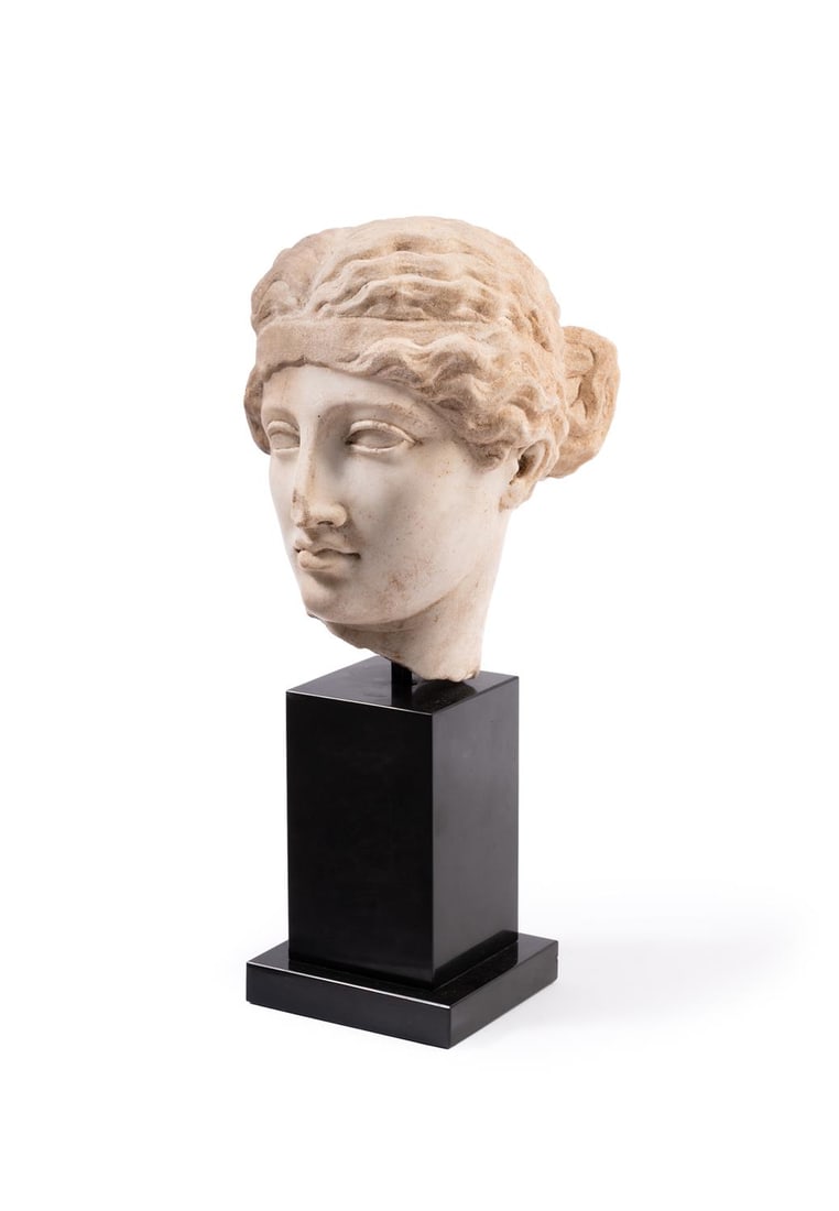 A ROMAN MARBLE HEAD OF A WOMAN WEARING A FILLET (1 of 3)