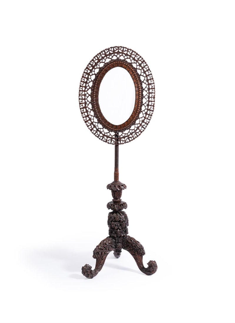 A CARVED BOMBAY BLACKWOOD ADJUSTABLE MIRROR, ANGLO-INDIAN, MID-19TH CENTURY