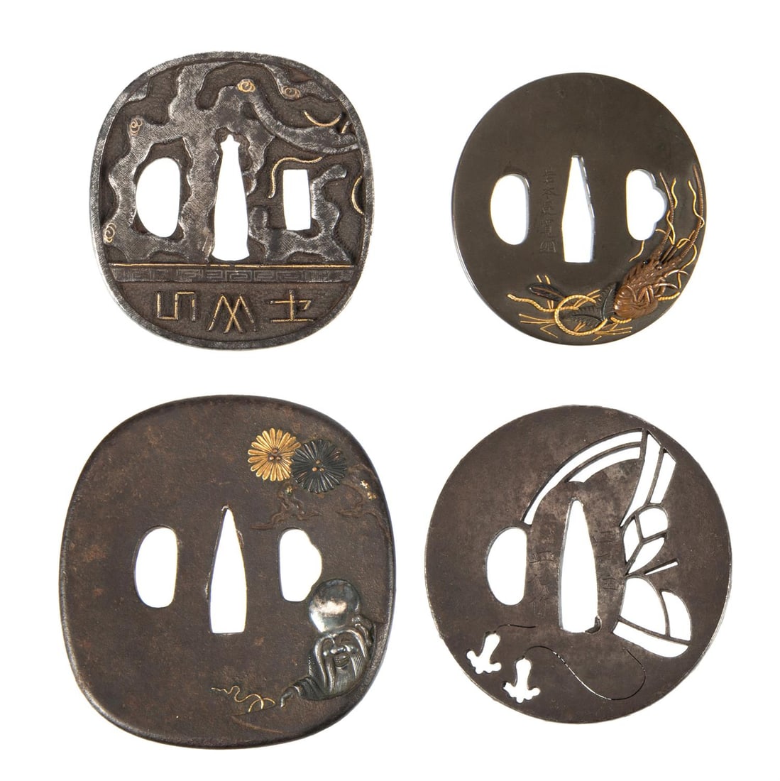 ‡ Four iron tsuba, Edo period 18th-19th century: ‡ Property from the Collection of Jean SaportaFour iron tsubaEdo period 18th - 19th centuryThe first decorated in gold and silver with a serpent and masonic inscription; the second sukashi pierc