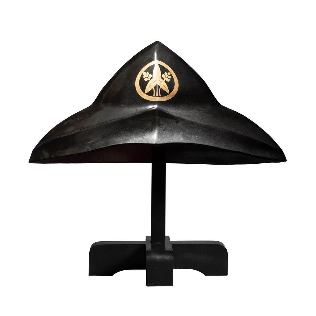 ‡ A black lacquer jingasa [war hat], Edo period: ‡ Property from the Collection of Jean SaportaA black lacquer jingasa [war hat]Edo period, 17th centurythe domed black lacquer jingasa with undulating rim, decorated in gold hiramaki-e with omod