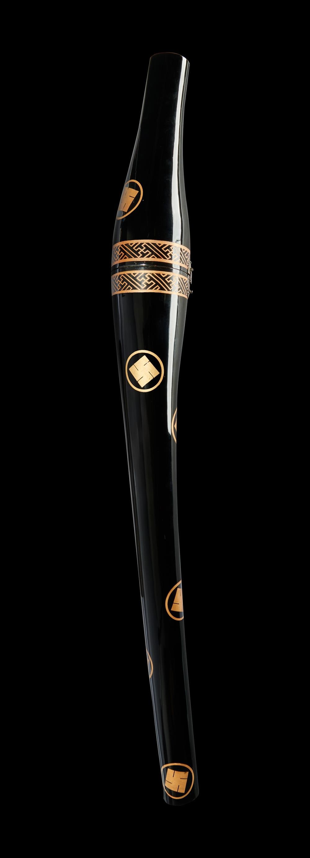 A rare katana-tsuzu [sword case], Edo period: The Property of an English GentlemanA rare katana-tsuzu [sword case] Edo period, 18th - 19th century the black lacquer sword case decorated in gold hiramaki-e with scattered encircled manji mon[manji