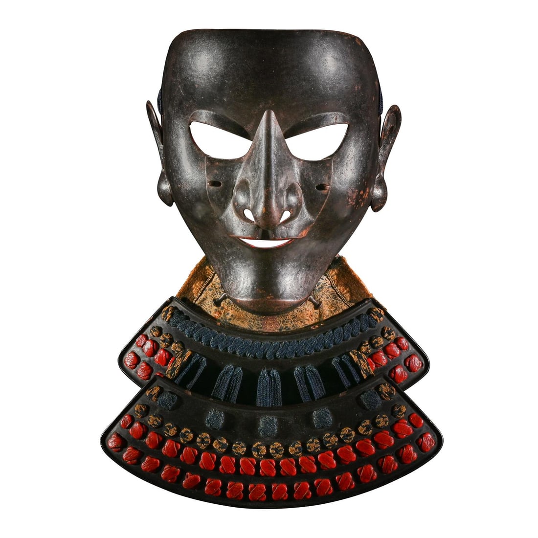 A somen [full face mask], Edo period: The Property of an English GentlemanA somen [full face mask]Edo period, 17th century the russet iron face mask with slightly open mouth and pronounced chin, detachable nose-plate, Negoro style red lac