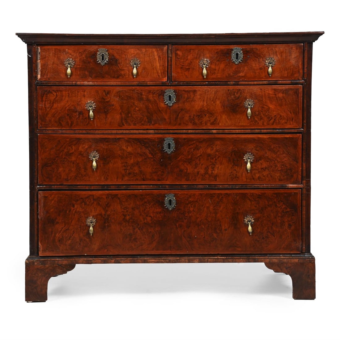 A GEORGE I FIGURED WALNUT AND FEATHERBANDED CHEST OF DRAWERS, CIRCA 1725 (1 of 3)