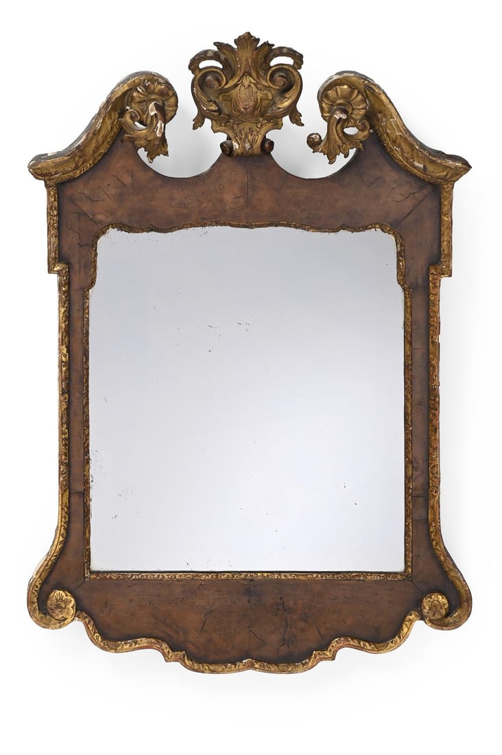 A GEORGE II WALNUT AND PARCEL GILT MIRROR, CIRCA 1740 (1 of 2)