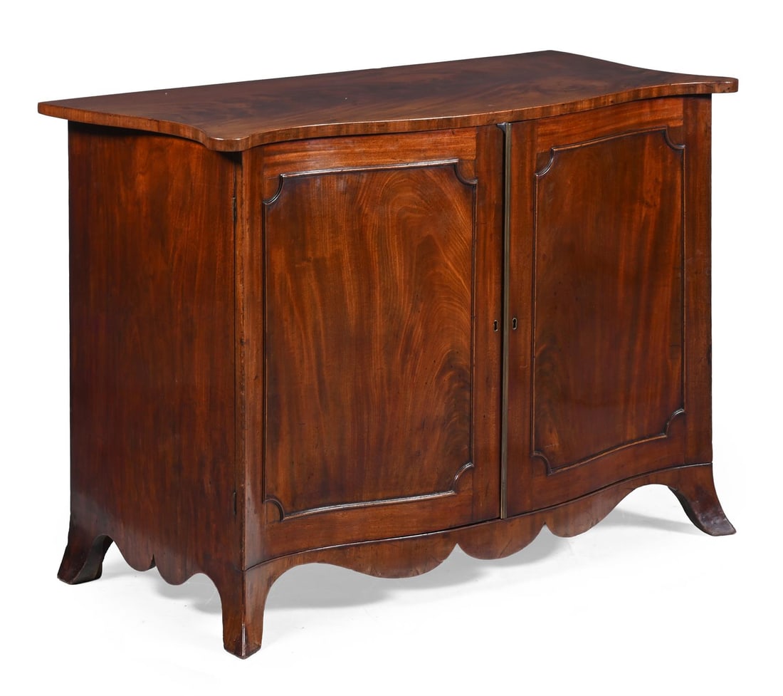 A GEORGE III MAHOGANY SERPENTINE SIDE CABINET, CIRCA 1790 (1 of 4)