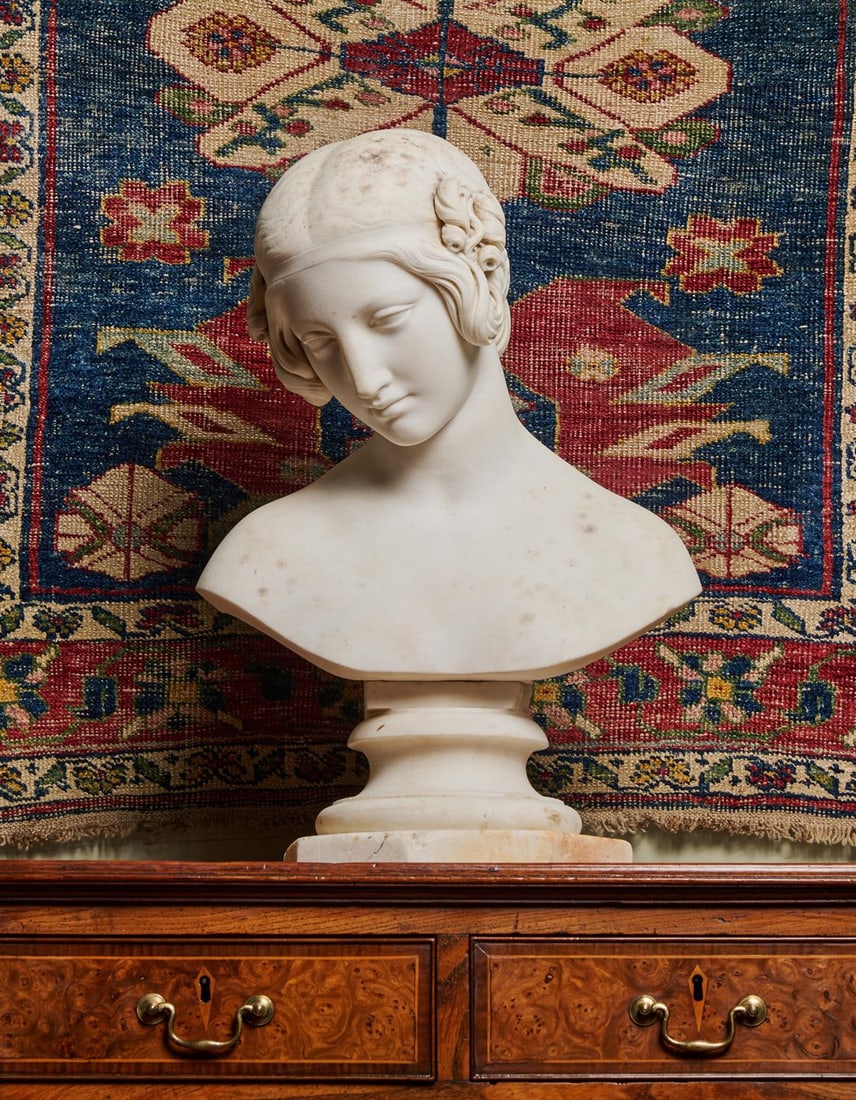 RICHARD JAMES WYATT (1795-1850), A WHITE MARBLE BUST OF A YOUNG NYMPH, CIRCA 1830-1850: RICHARD JAMES WYATT (1795-1850), A WHITE MARBLE BUST OF A YOUNG NYMPH CIRCA 1830-1850 On a turned socle and octagonal plinth, signed to the reverse R. J WYATT ROMAE 51cm high, the base 23cm wide Prove