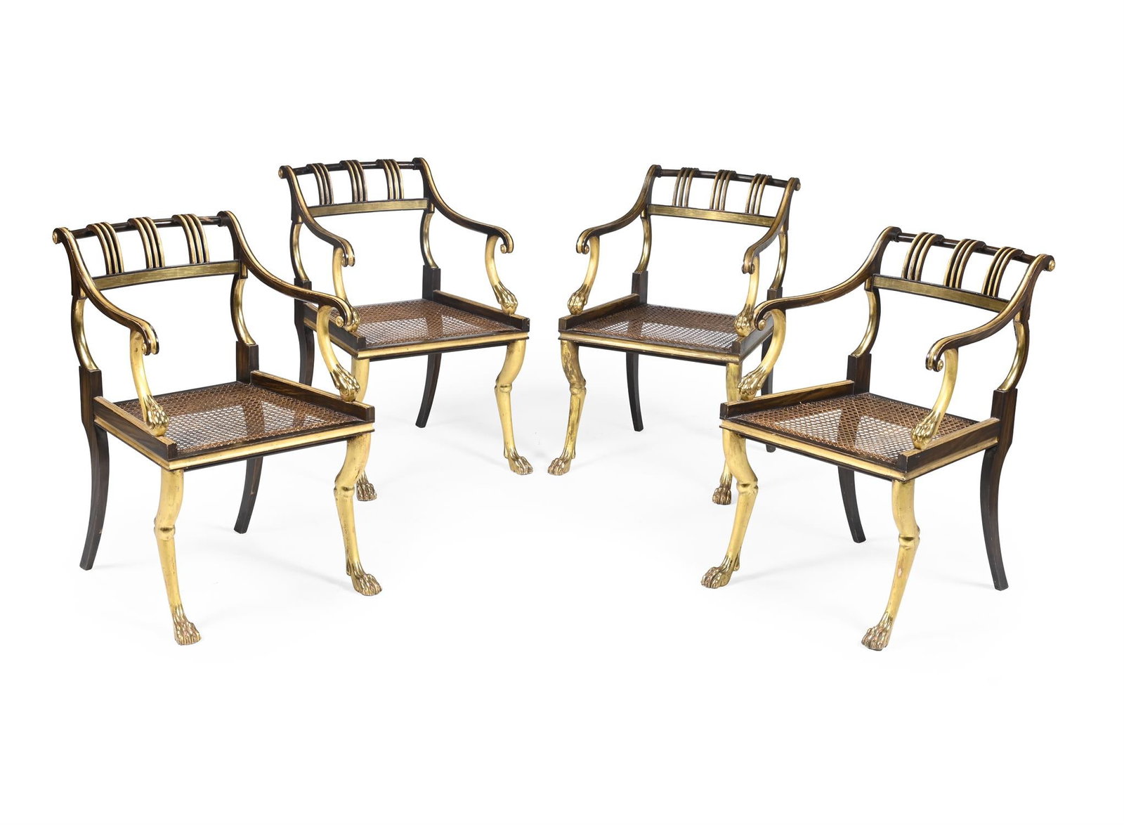 A SET OF FOUR REGENCY SIMULATED COROMANDEL AND PARCEL GILT OPEN ARMCHAIRS, CIRCA 1815: A SET OF FOUR REGENCY SIMULATED COROMANDEL AND PARCEL GILT OPEN ARMCHAIRS IN THE MANNER OF HENRY HOLLAND, CIRCA 1815 83cm high, 55cm wide, 58cm deep Provenance:Formerly Malmesbury House, The Cathedral