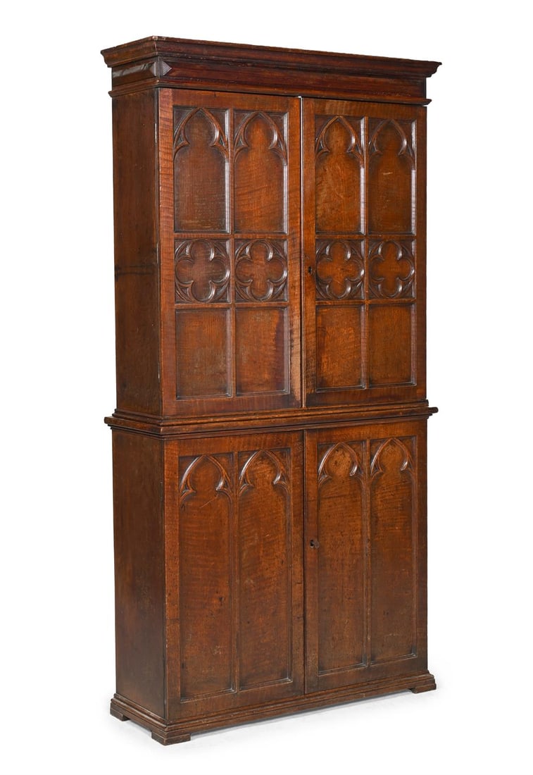 A VICTORIAN CARVED OAK BOOKCASE OR CUPBOARD, IN THE GOTHIC REVIVAL STYLE, SECOND HALF 19TH CENTURY (1 of 3)