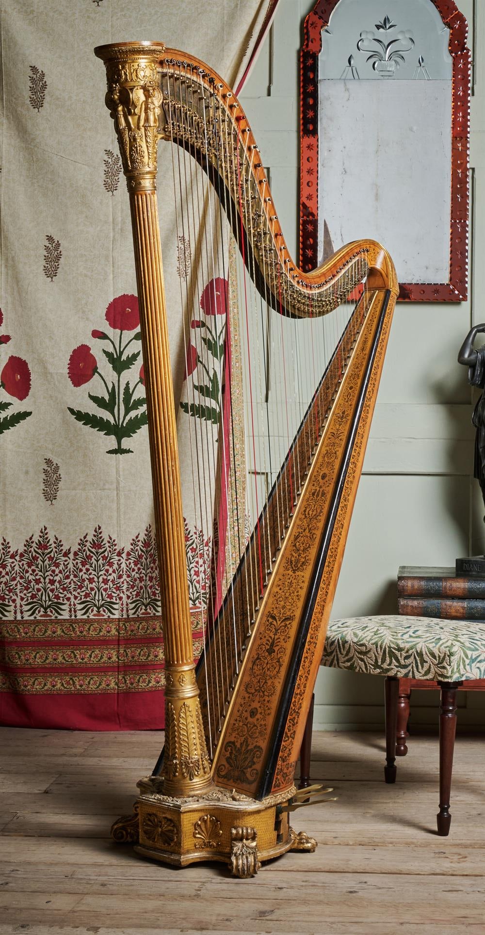 FREDERICK GROSJEAN, LONDON, A WILLIAM IV GRECIAN HARP, CIRCA 1835: FREDERICK GROSJEAN, LONDON, A WILLIAM IV GRECIAN HARP CIRCA 1835Gilt gesso and simulated satinwood frame with foliate and scroll stencil decoration, fluted column relief moulded with winged cherubs, a