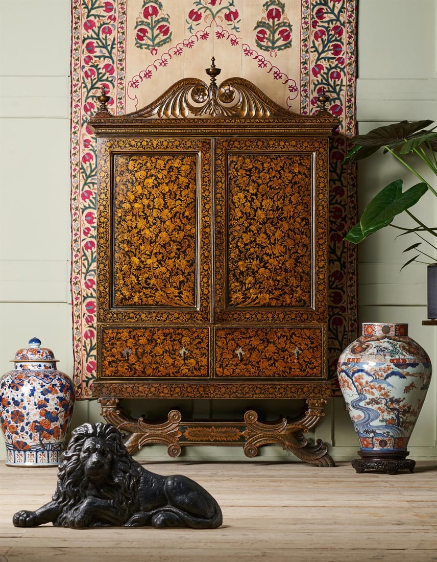 AN INDIAN BLACK AND GILT LACQUER CABINET ON STAND FROM BAREILLY, EARLY 19TH CENTURY: AN INDIAN BLACK, GREEN AND GILT LACQUER CABINET ON STAND BAREILLY, EARLY 19TH CENTURY190cm high, 118cm wide, 45cm deepProvenance:Private Collection, Swiftsden House, East Sussex