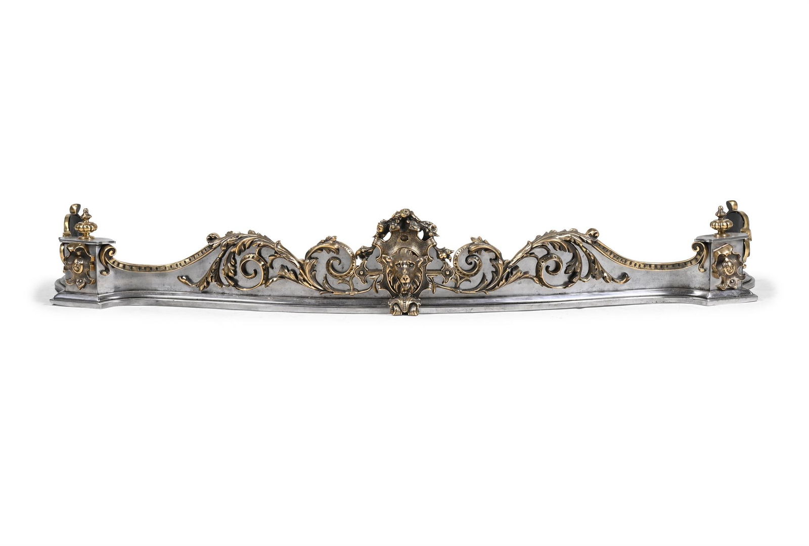 A VICTORIAN BRASS MOUNTED POLISHED STEEL SERPENTINE FENDER, CIRCA 1870-1890 (1 of 2)