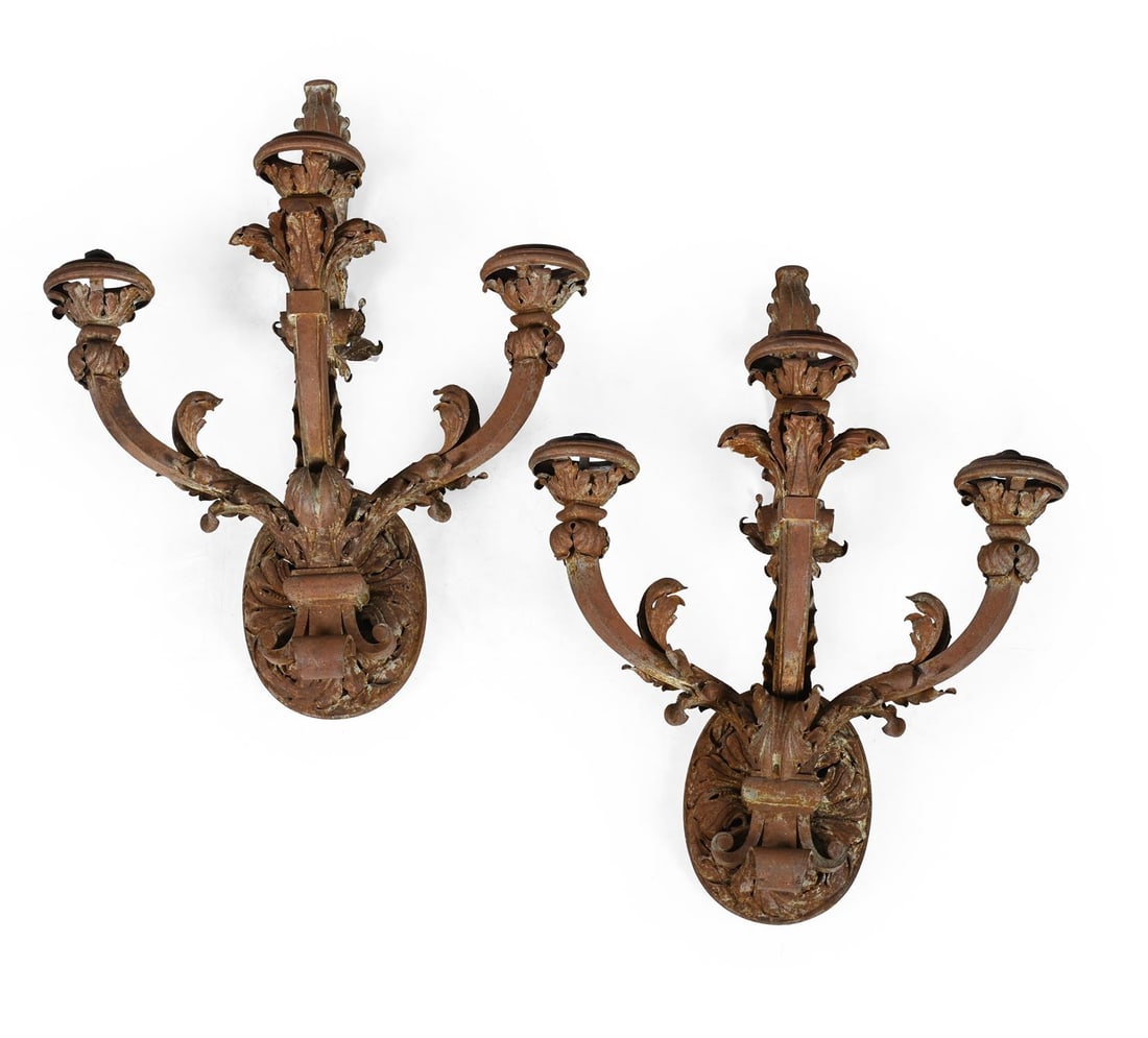 A LARGE PAIR OF SCROLLING WROUGHT IRON THREE BRANCH WALL LIGHTS, CONTINENTAL, LATE 19TH CENTURY: A LARGE PAIR OF SCROLLING WROUGHT IRON THREE BRANCH WALL LIGHTS CONTINENTAL, LATE 19TH CENTURY approximately 91cm high, 69cm wide, 36cm deep